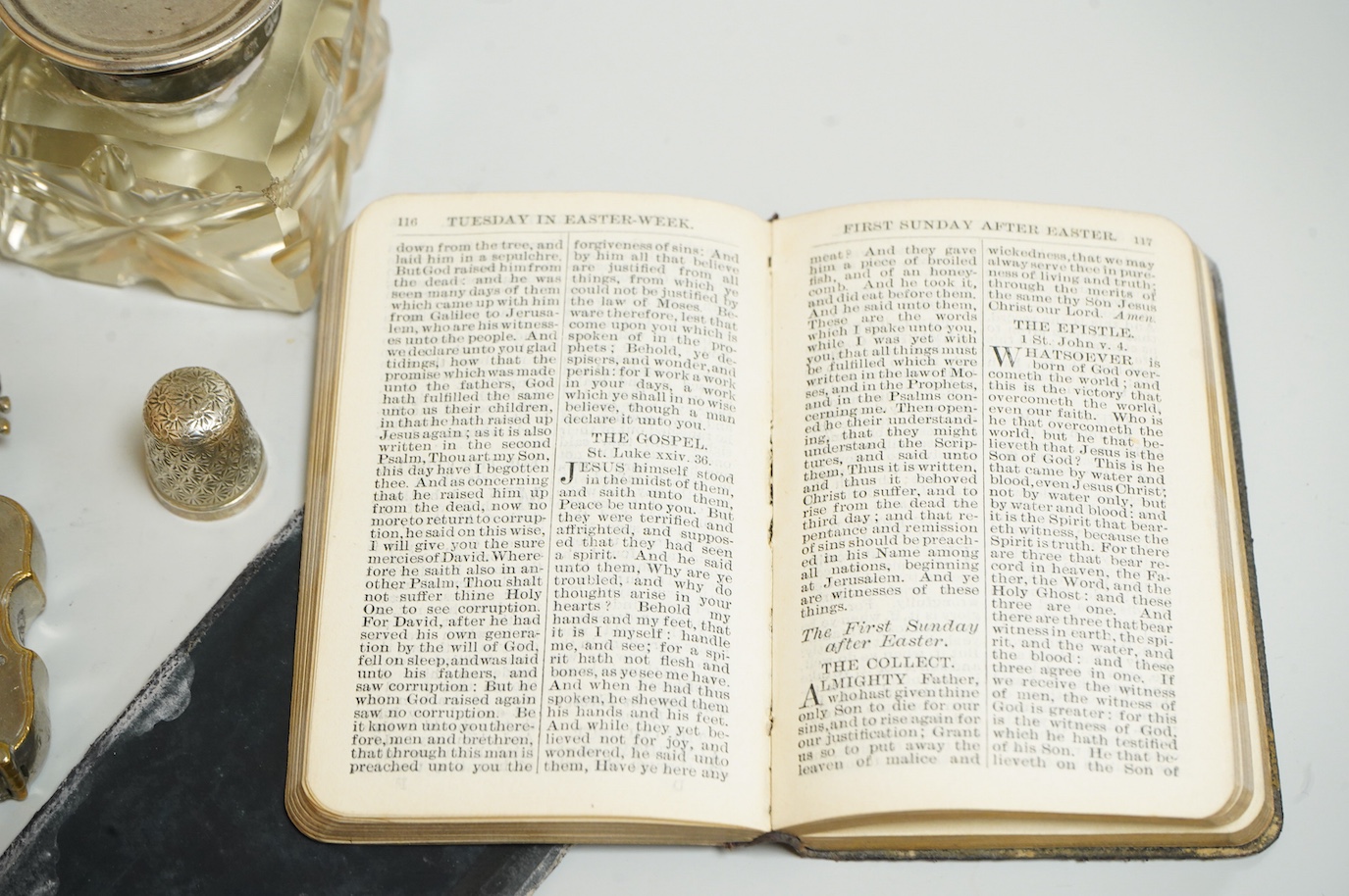 A small group of silver and other items, including an Edwardian silver mounted Common Prayer book(a.f.), a silver mounted matches holder, a silver mounted glass inkwell, a silver and mother of pearl fruit knife, two thim